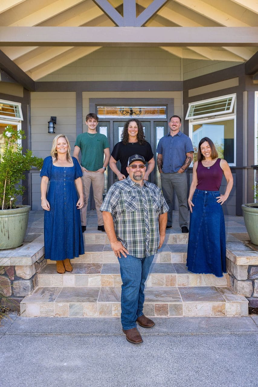 Team Gozzarino realtors on porch steps Team Gozzarino realtors on porch steps